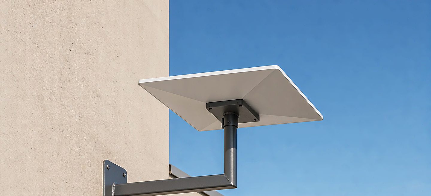 An official Starlink mount beside a third-party bracket, both accepting the dish pipe thread
